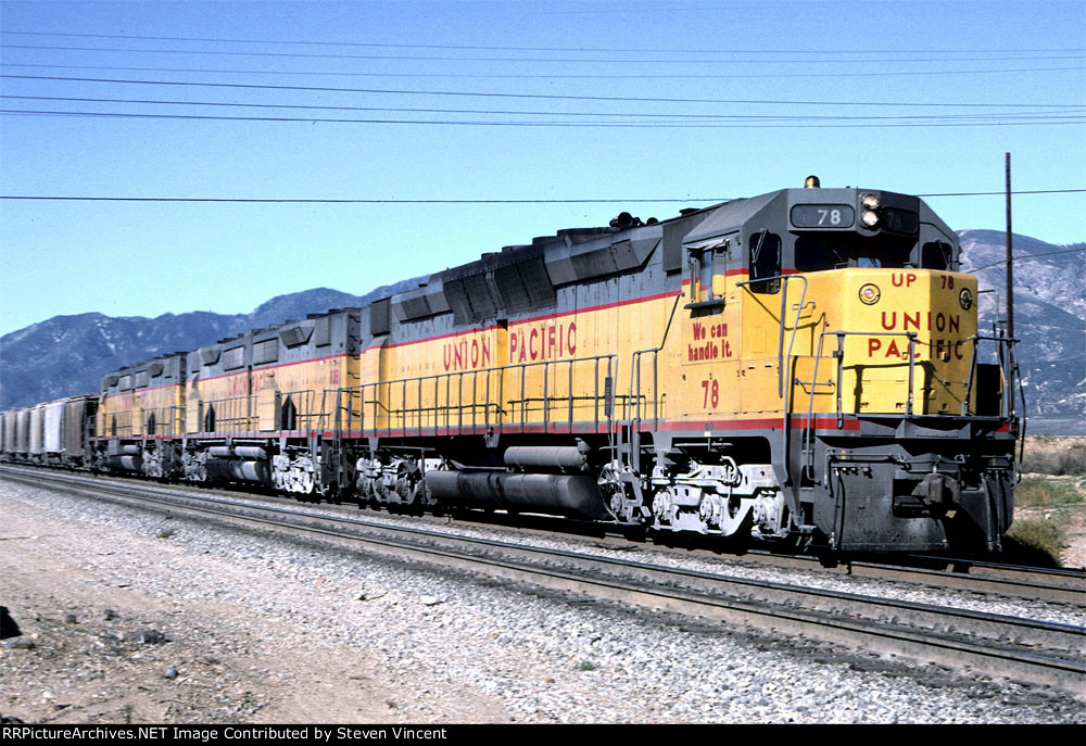 Union Pacific WB with DD35A #78. Large!cement pickup from Victorville area on head end.